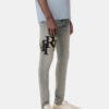 SKINNY JEANS MED FÖRSKJUTET LOGO