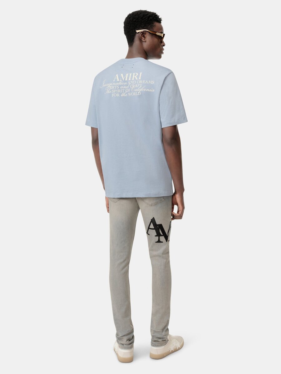 SKINNY JEANS MED FÖRSKJUTET LOGO