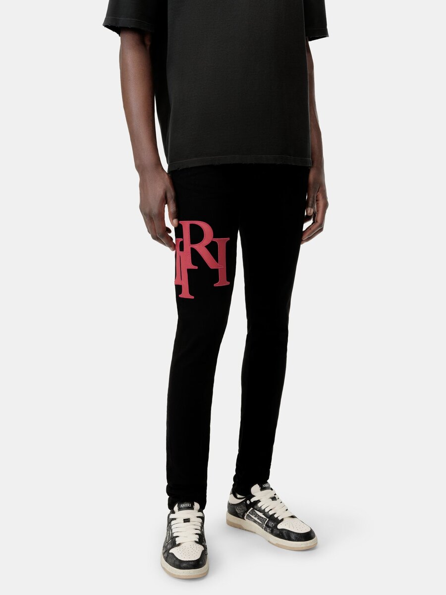 SKINNY JEANS MED FÖRSKJUTET LOGO – Svart Röd