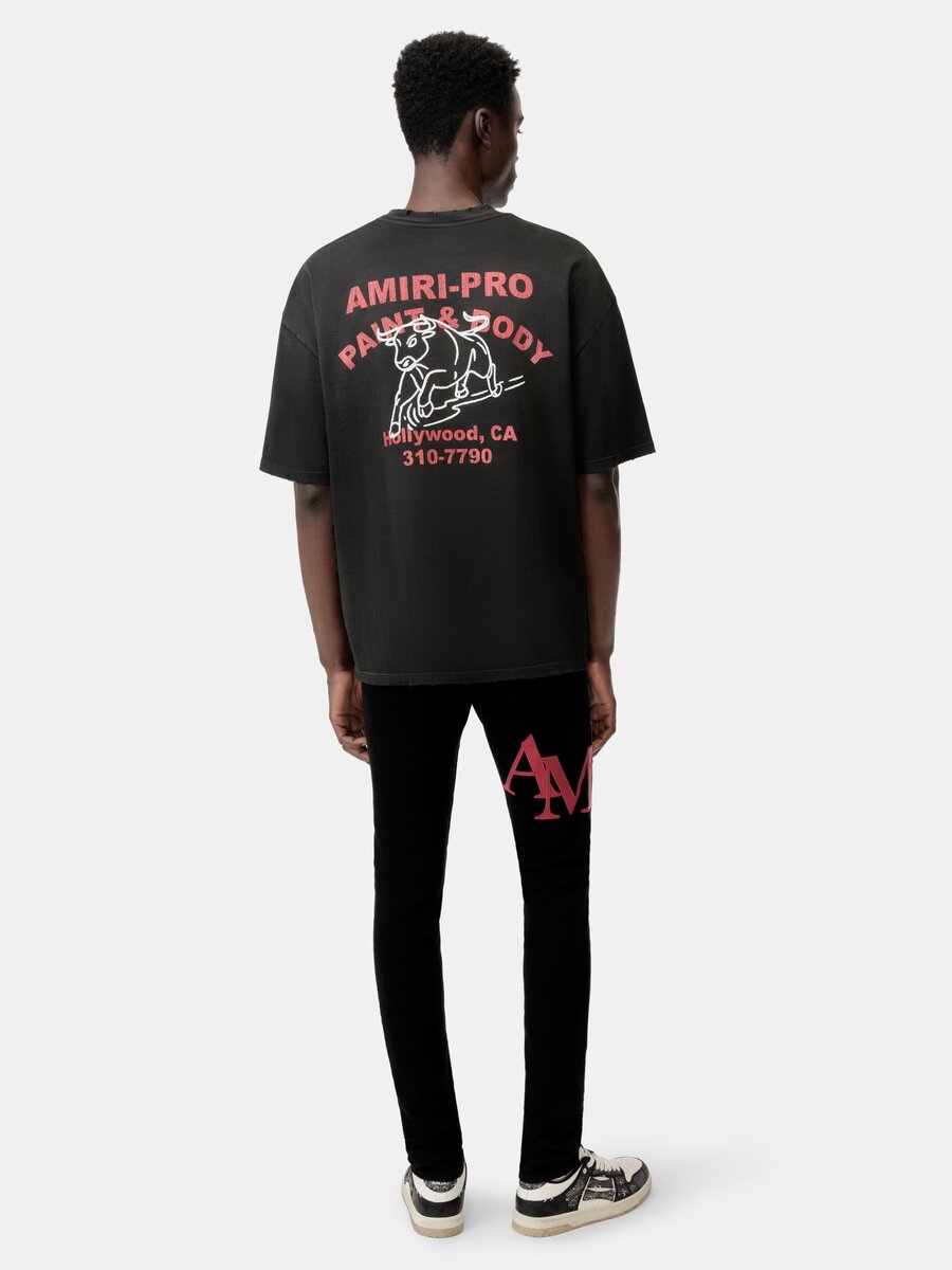 SKINNY JEANS MED FÖRSKJUTET LOGO – Svart Röd